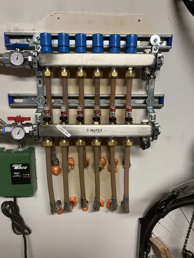 Plumber performing Gas Line Installation at a residential property in Hubbard